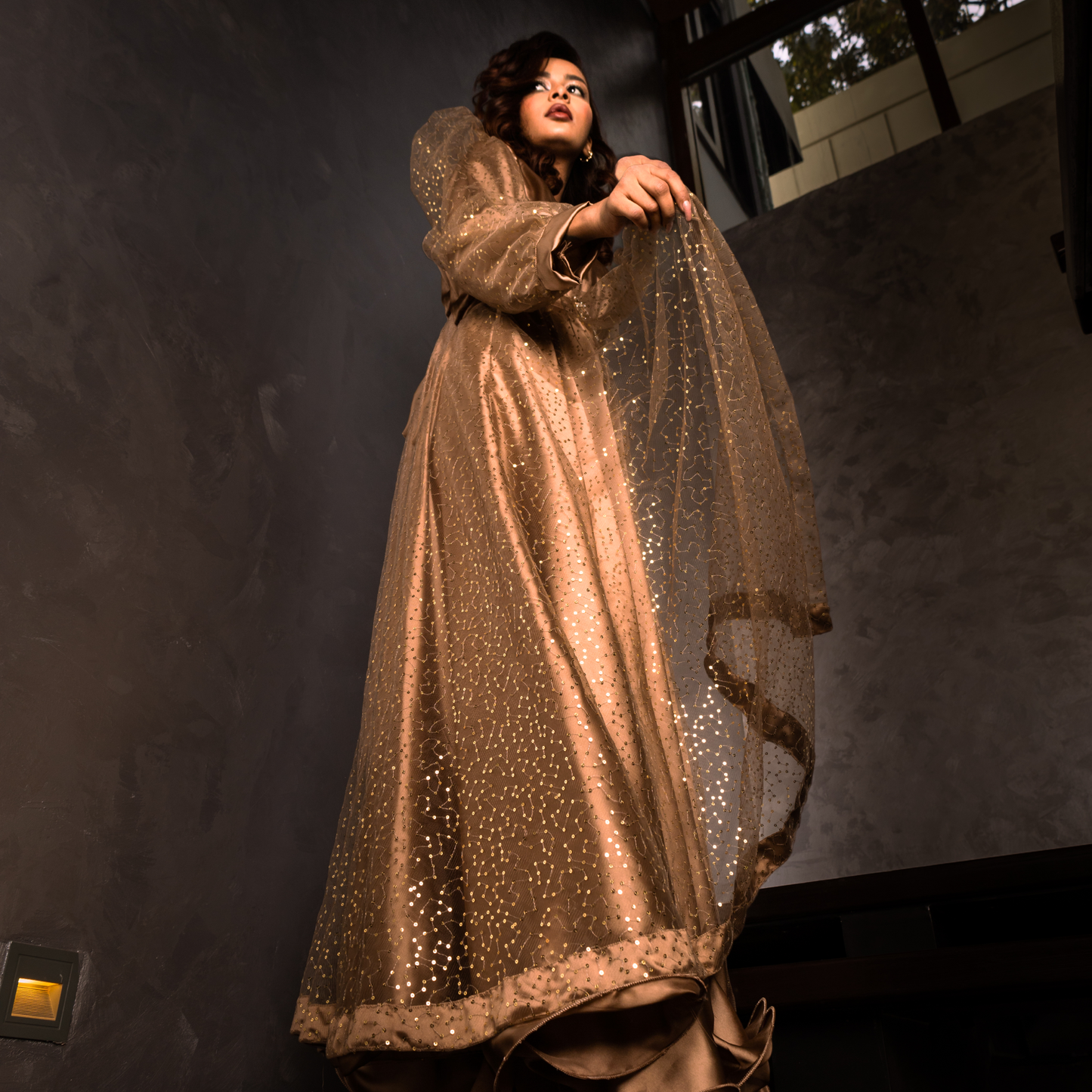 Golden Sands maxi dress – shimmering net outer layer with golden sequins and a delicately piped ribbon hem.