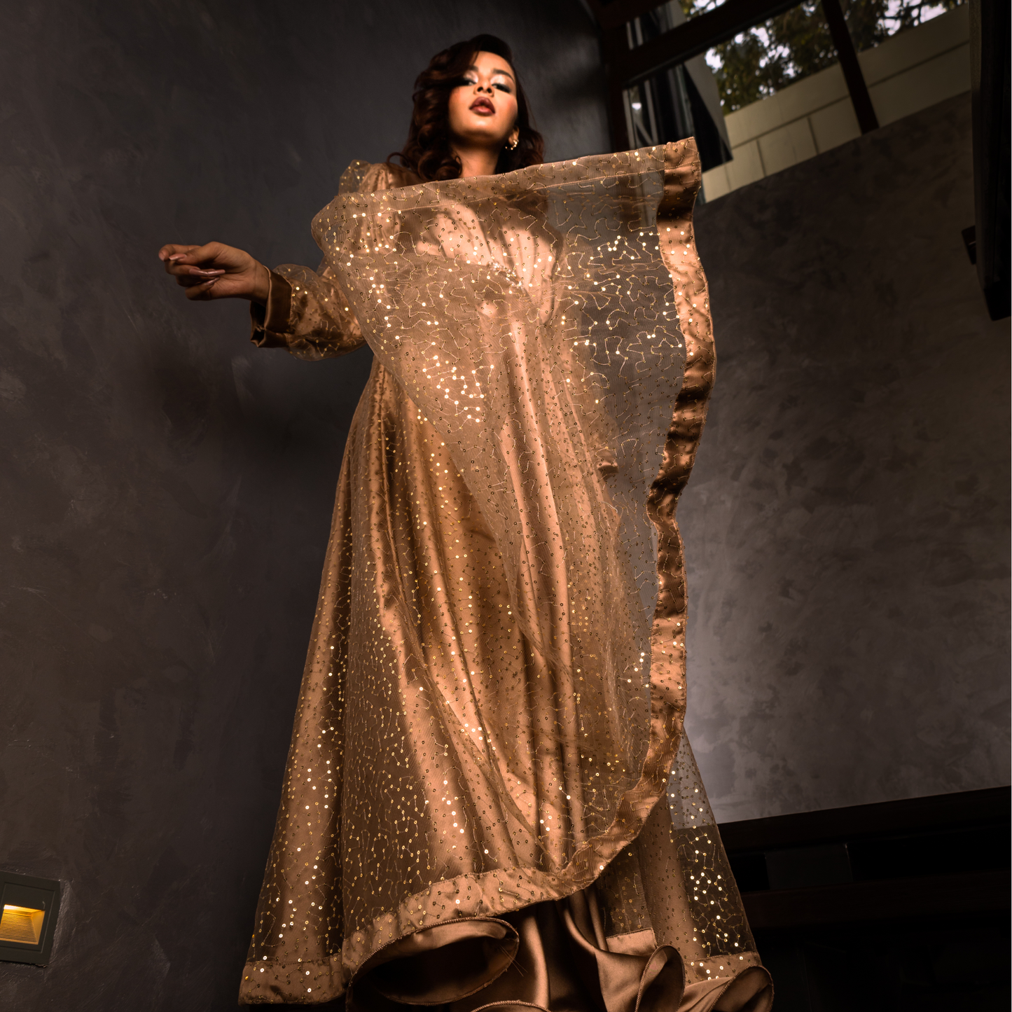 Golden Sands gown hem – double-layered flare with satin silk underlayer and curled hem for added volume