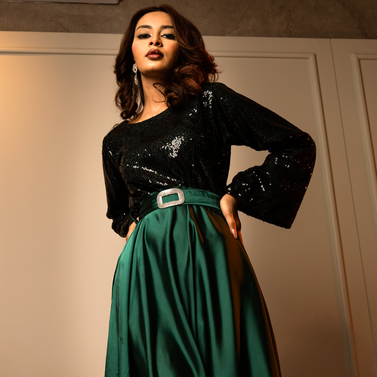 Detailed view of the fully sequined bodice with intricate embellishments on a satin silk evening gown.