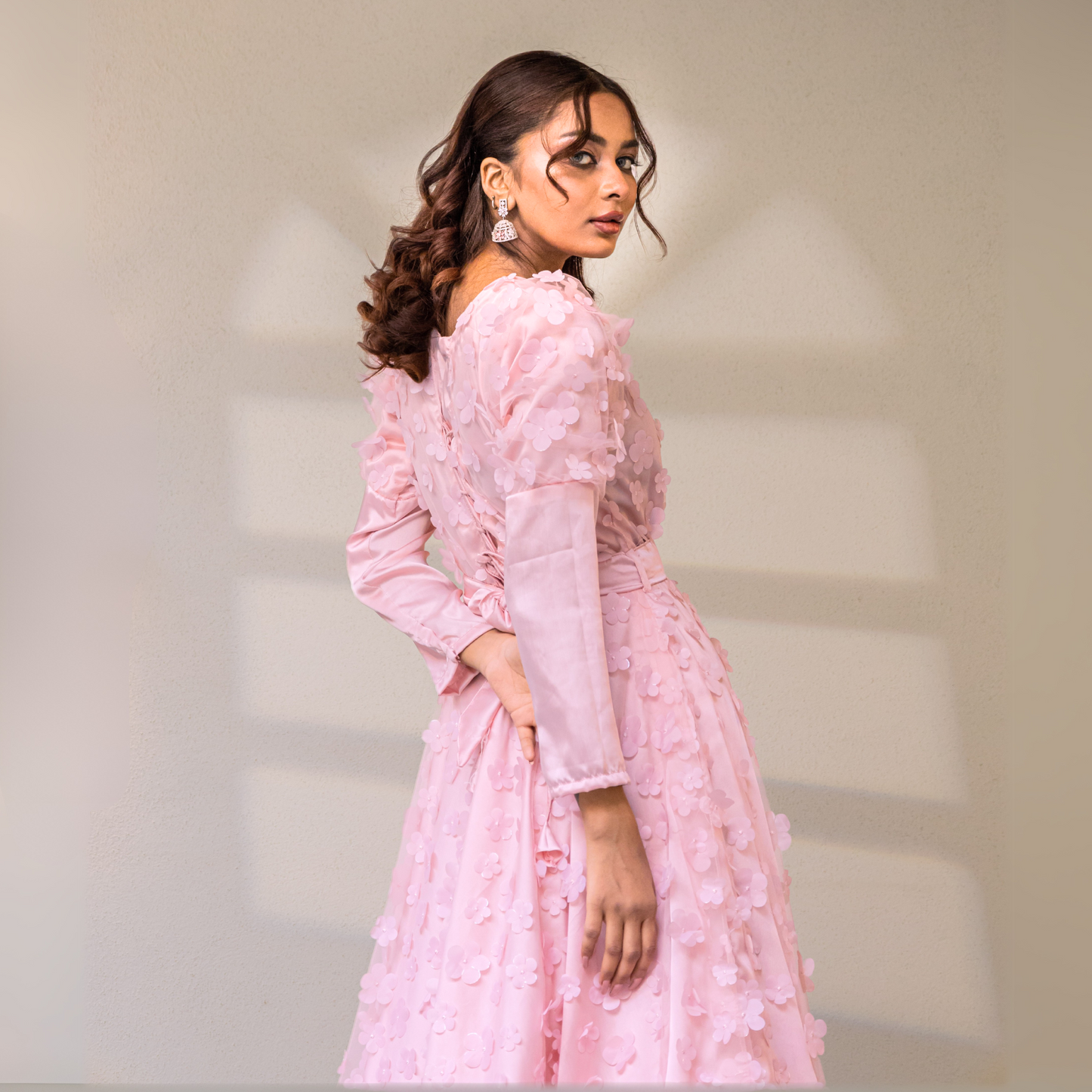 Four-layered flare with cancan, satin silk, and 3D floral net, finished with a piped ribbon hem.