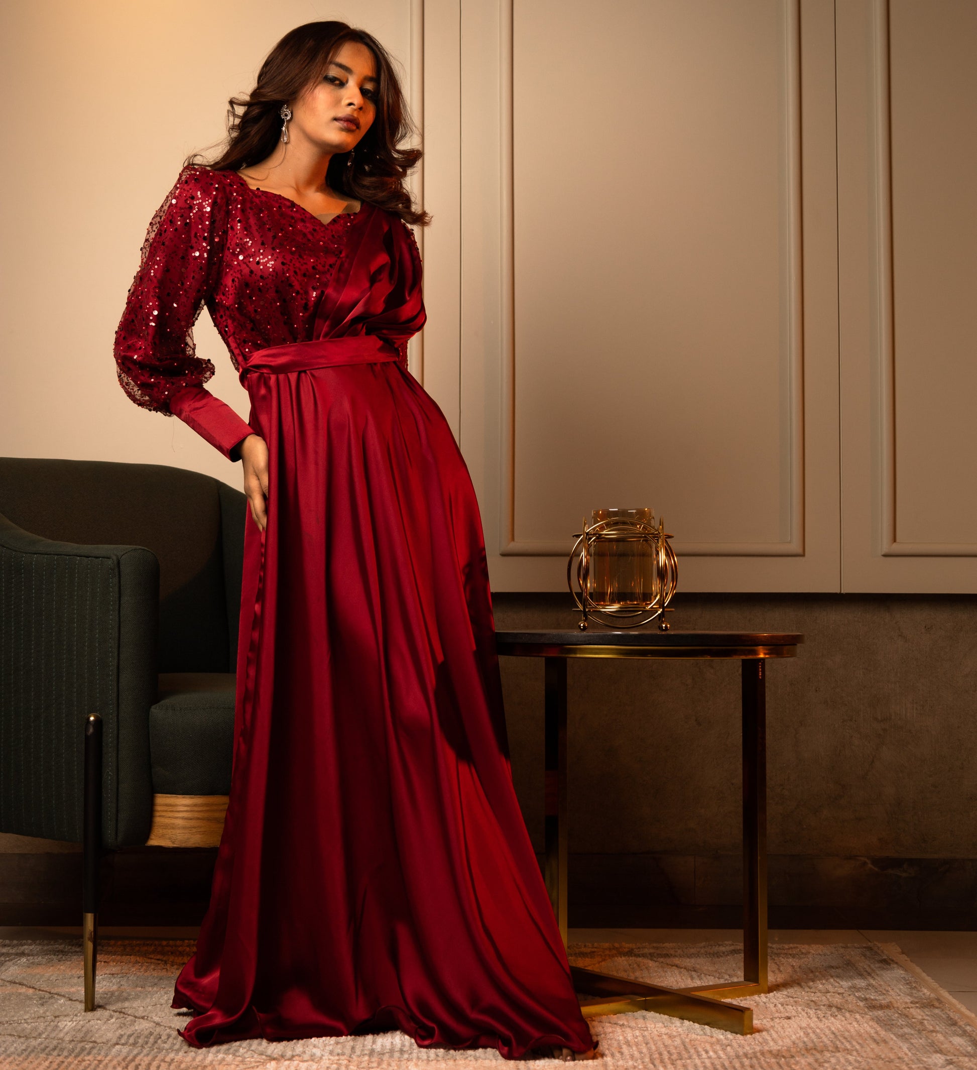 Regal red evening gown with a fully sequined bodice, princess seams, and a flowing silhouette.